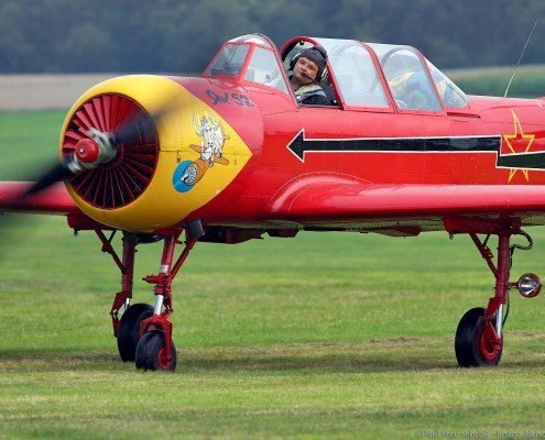 Yak-52 airplane just after landing on grass