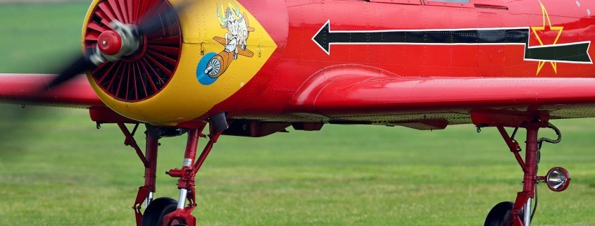 Yak-52 airplane just after landing on grass